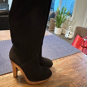Tall black suede boots with wooden heel